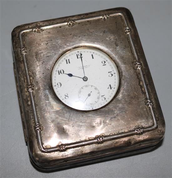 An Edwardian silver mounted travelling watch case with silver pocket watch, 3.75in.